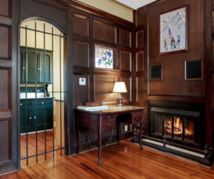 The wood panel walls and fireplace give this room a warm atmosphere.