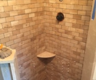44 The tiny shower seemed bigger after we used a lighter color porcelain on the walls.