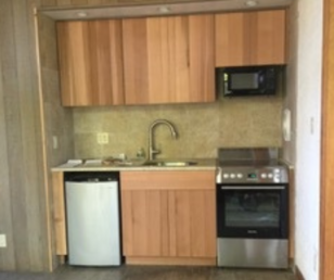 The kitchenette was updated with new appliances and cabinets. Small but efficient. 