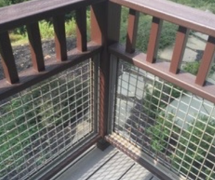 The west side of cottage includes a small deck. We did the railings and decking in Trex to minimize annual maintenance.