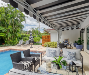 A new awning in classic Palm Beach stripes compliment the black and white furnishings.
