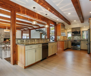 When you step oof the elevator you are entering what is now a seamless floor plan. The kitchen and dining room flow easily together for gatherings and gracious entertaining. 