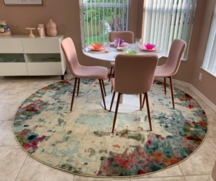 I used a colorful rug that would conceal any spills. Since we weren't changing the wall color, we found a set of desert pink chairs to compliment the walls. 